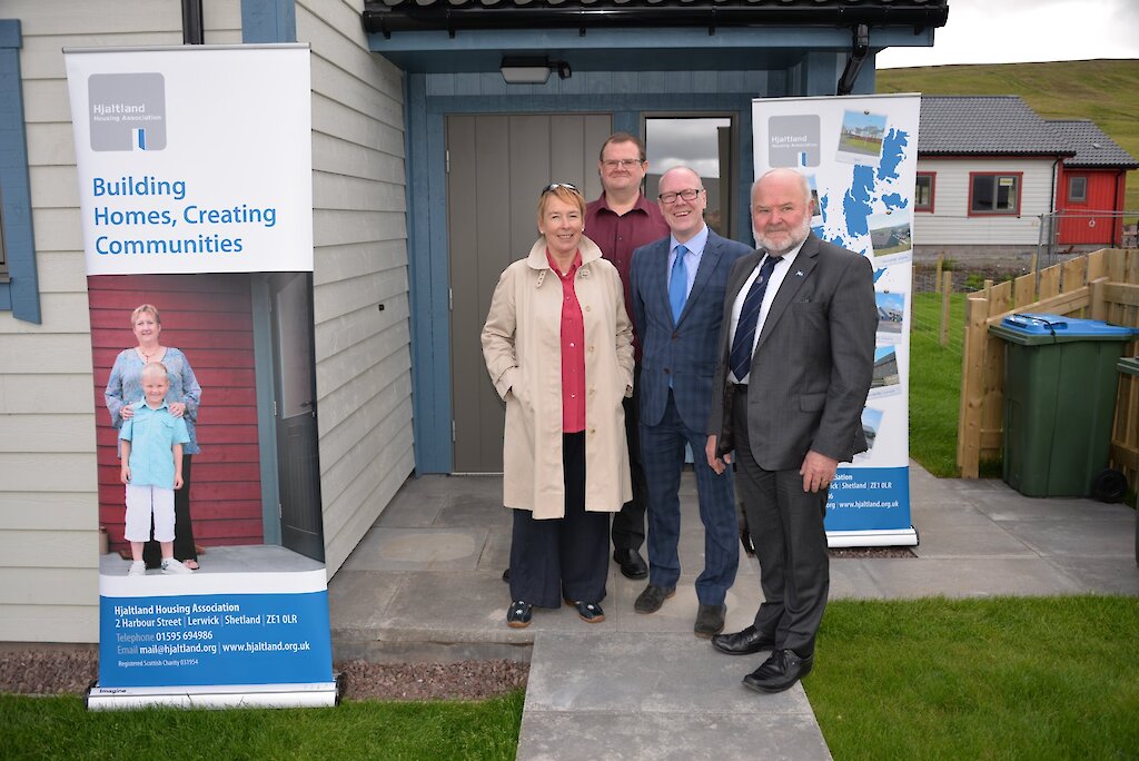 Hjaltland Housing Associations new chairperson Agnes Tallack and chief Executive Bryan Leask welcome the housing Minister Kevin Stewart and the chair of the SIC development Committee Alastair Cooper.